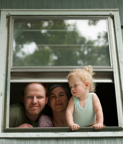 Family looking through window